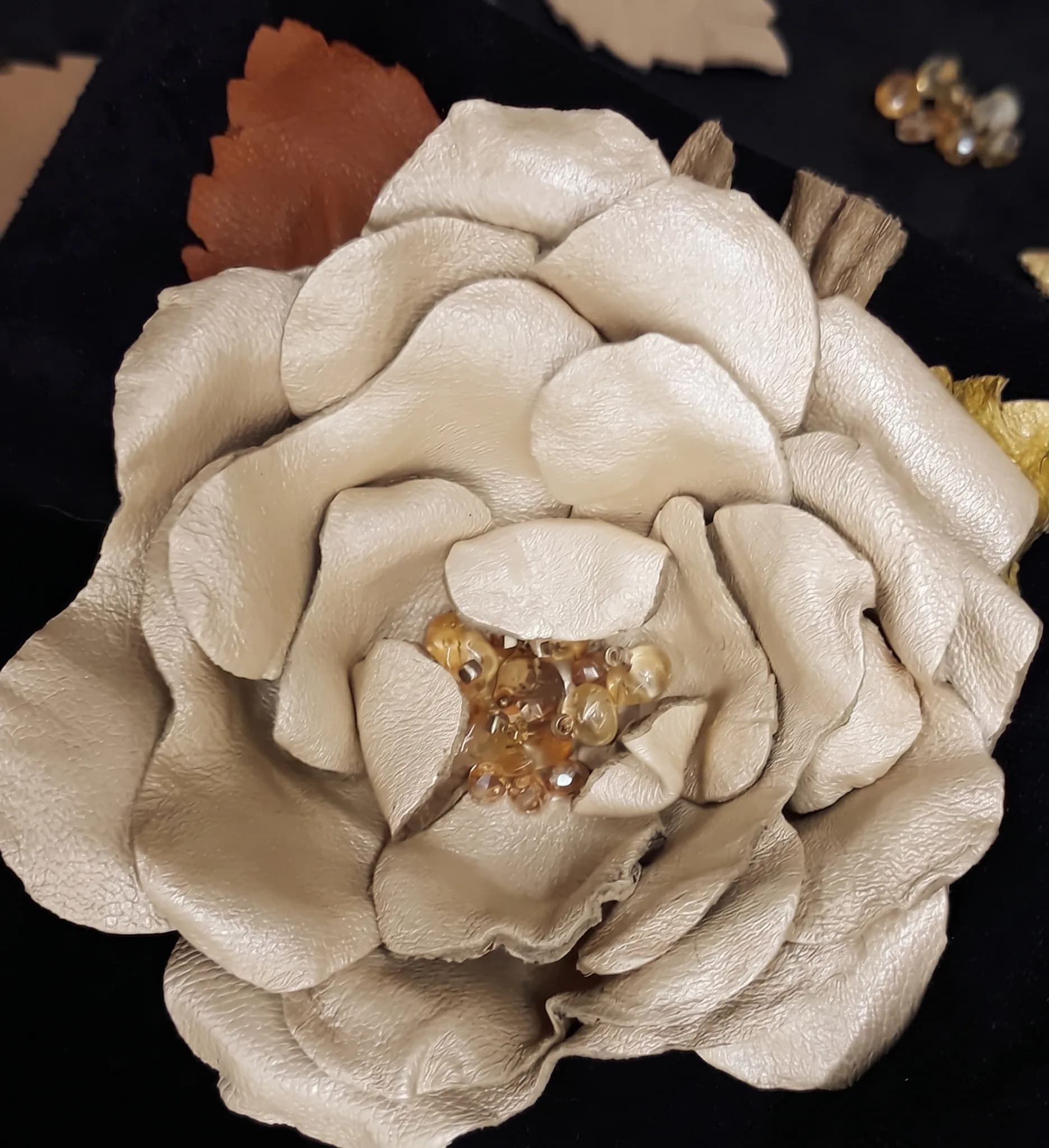 Beige leather brooch with natural stones