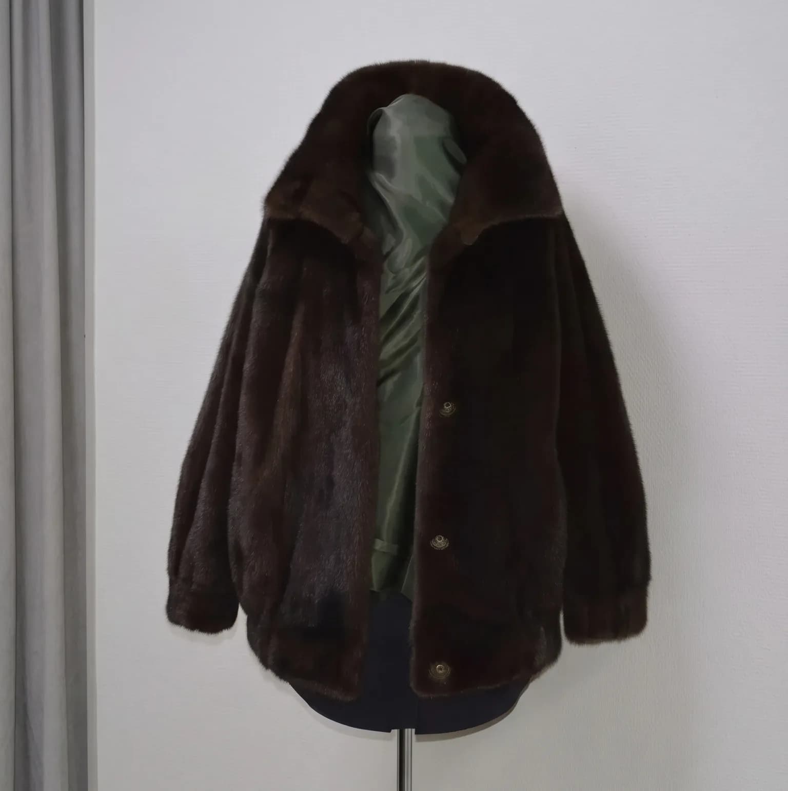 Mahogany mink bomber jacket with a fleur-de-lis