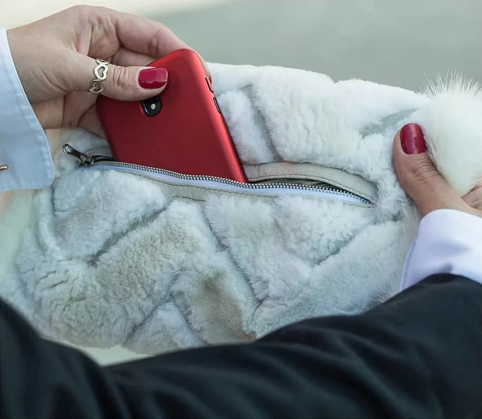 White fur muff with a cable-knit effect