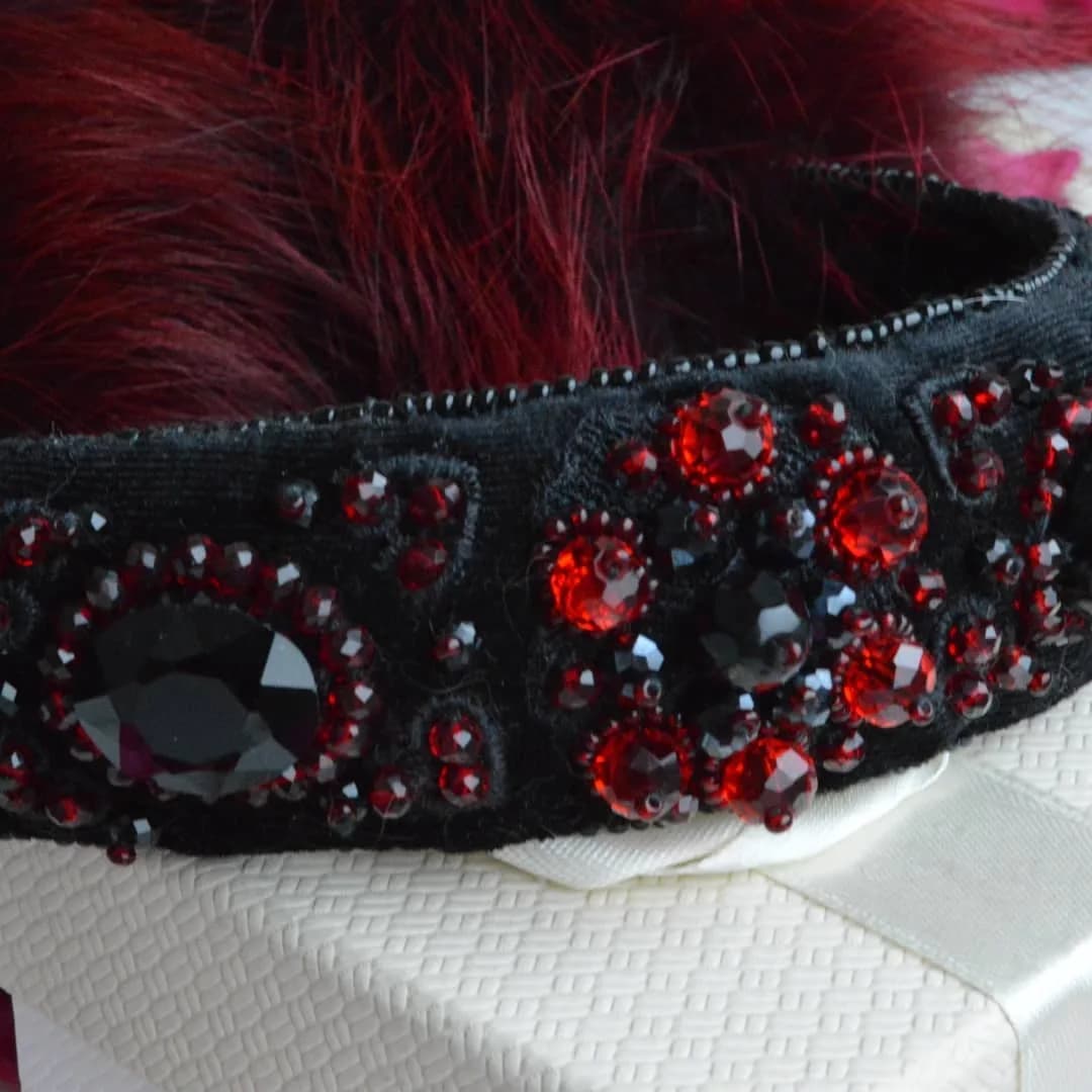Burgundy raccoon fur earmuffs with natural stones