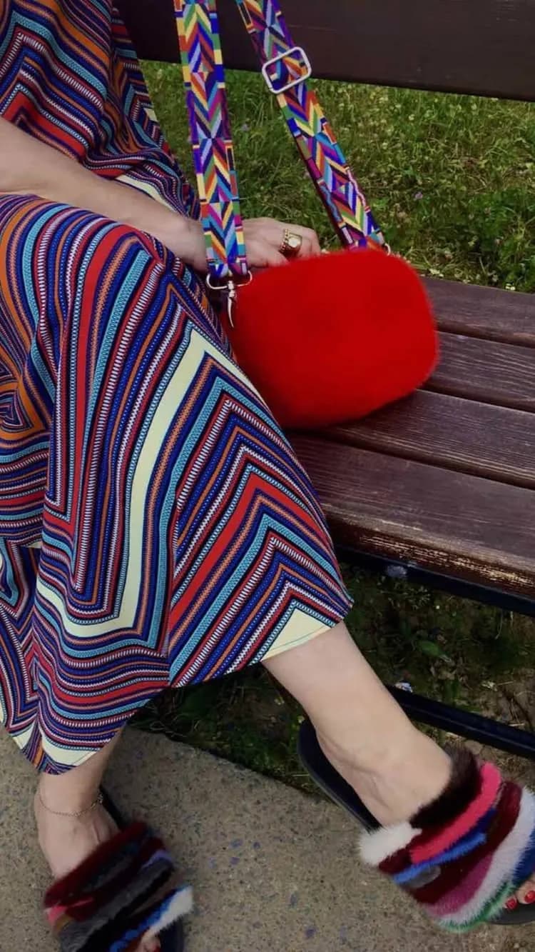 Red mink bag with a patterned strap