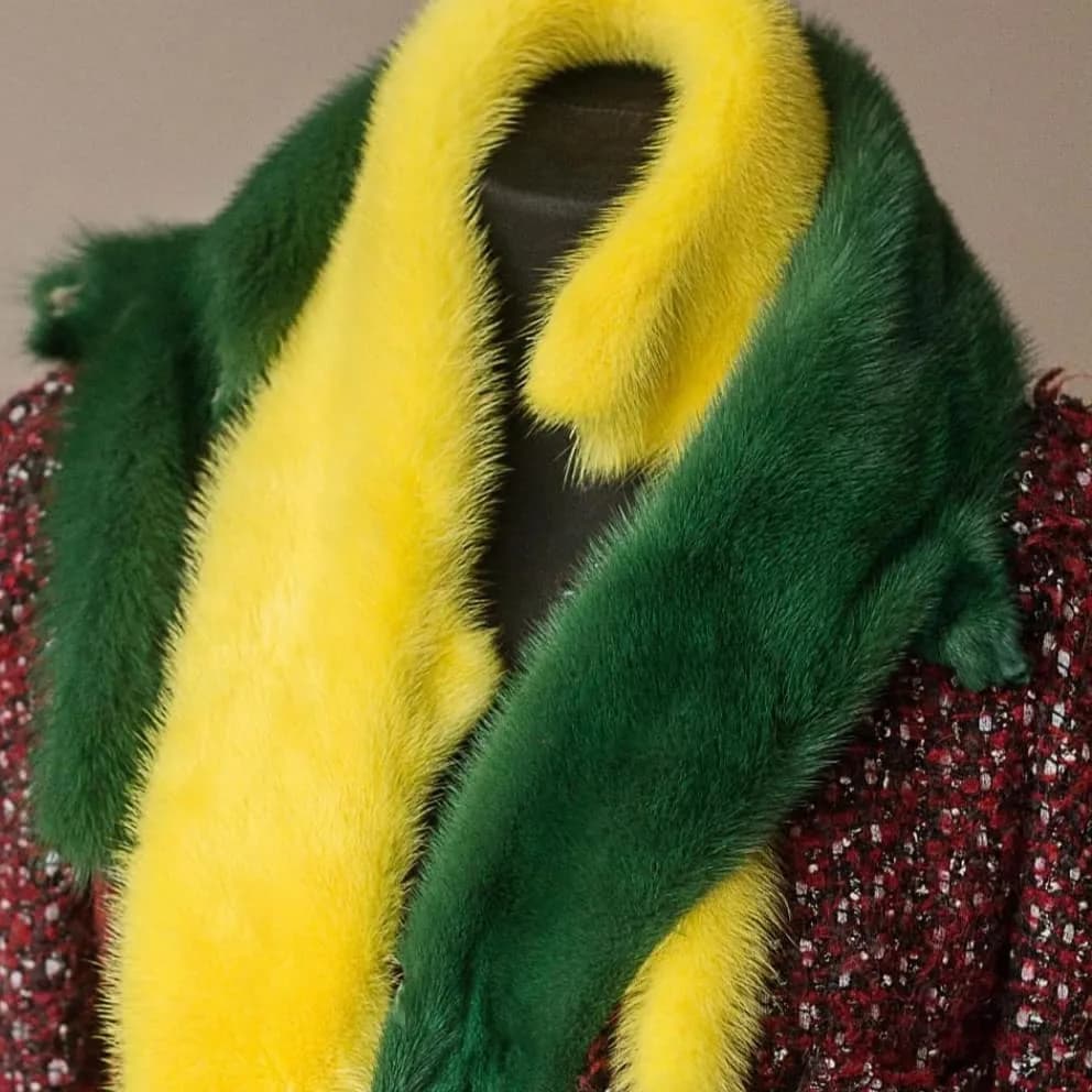 Yellow and green pelts draped over a mannequin’s shoulders