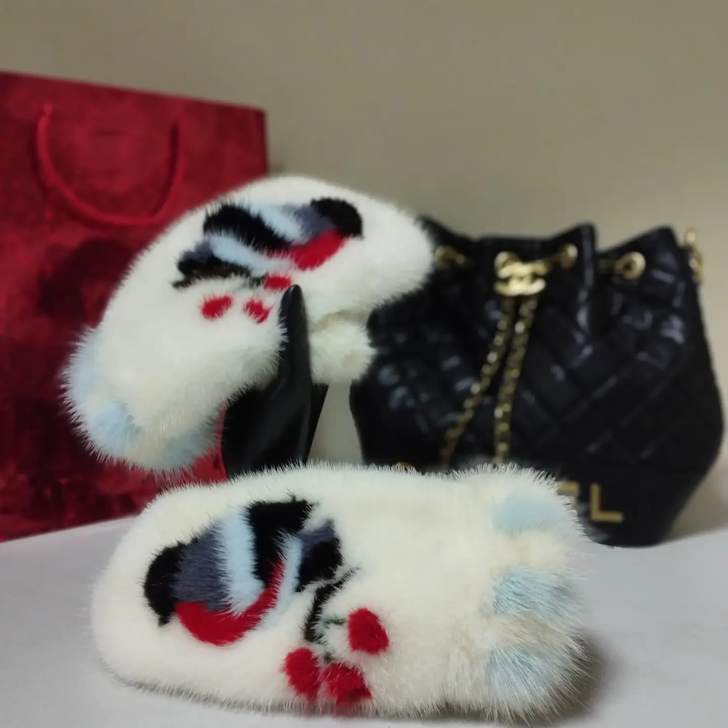 White mink mittens with bullfinches and pale blue trim